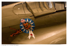 P-40E Kittyhawk painted in Flying Tigers colors on static display at the National Museum of the Air Force on November 28, 2010